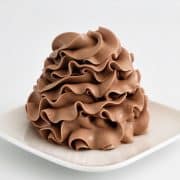 Chocolate condensed milk buttercream ruffled swirl with hot fudge
