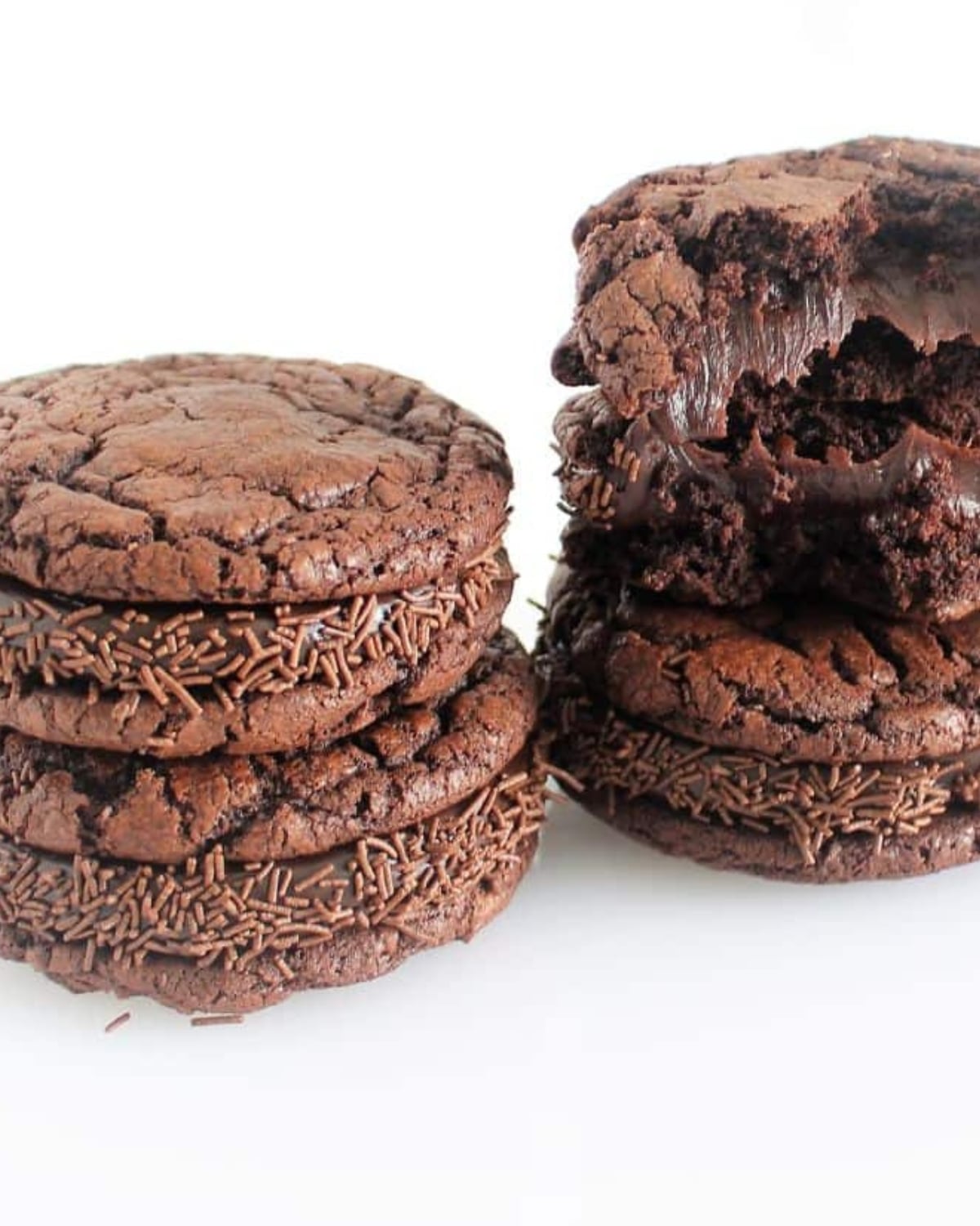Brownie Cookie Sandwiches filled with creamy Brigadeiro chocolate filling stacked on a white plate