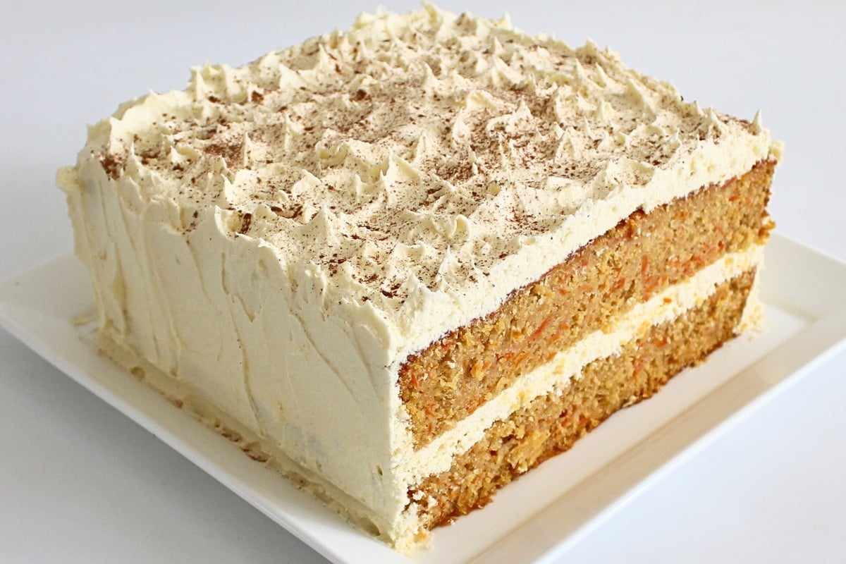 Close-up of layer cake showing moist crumb and creamy frosting