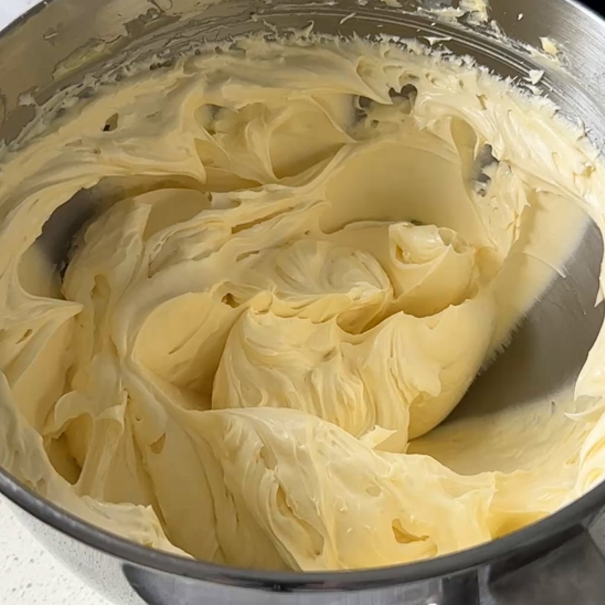 Smooth buttercream in a stand mixer bowl before chocolate is added