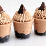 cup filled with Toblerone dessert cup layers of cookie base, mousse, and whipped cream