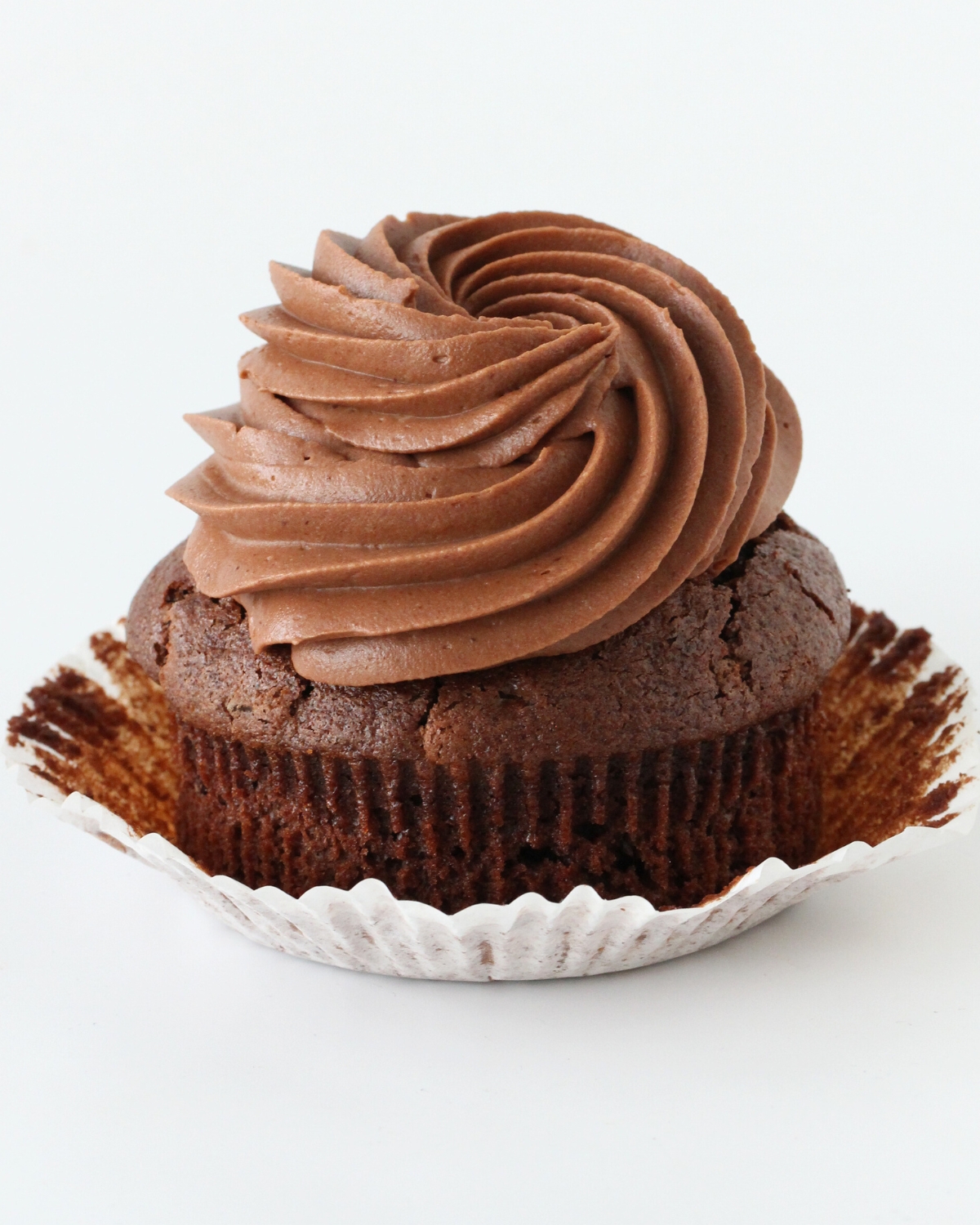 Chocolate cupcake topped with smooth chocolate cream cheese frosting swirl