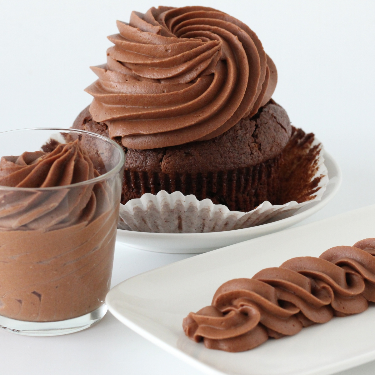 Chocolate cream cheese frosting piped onto cupcake and swirled for decorating