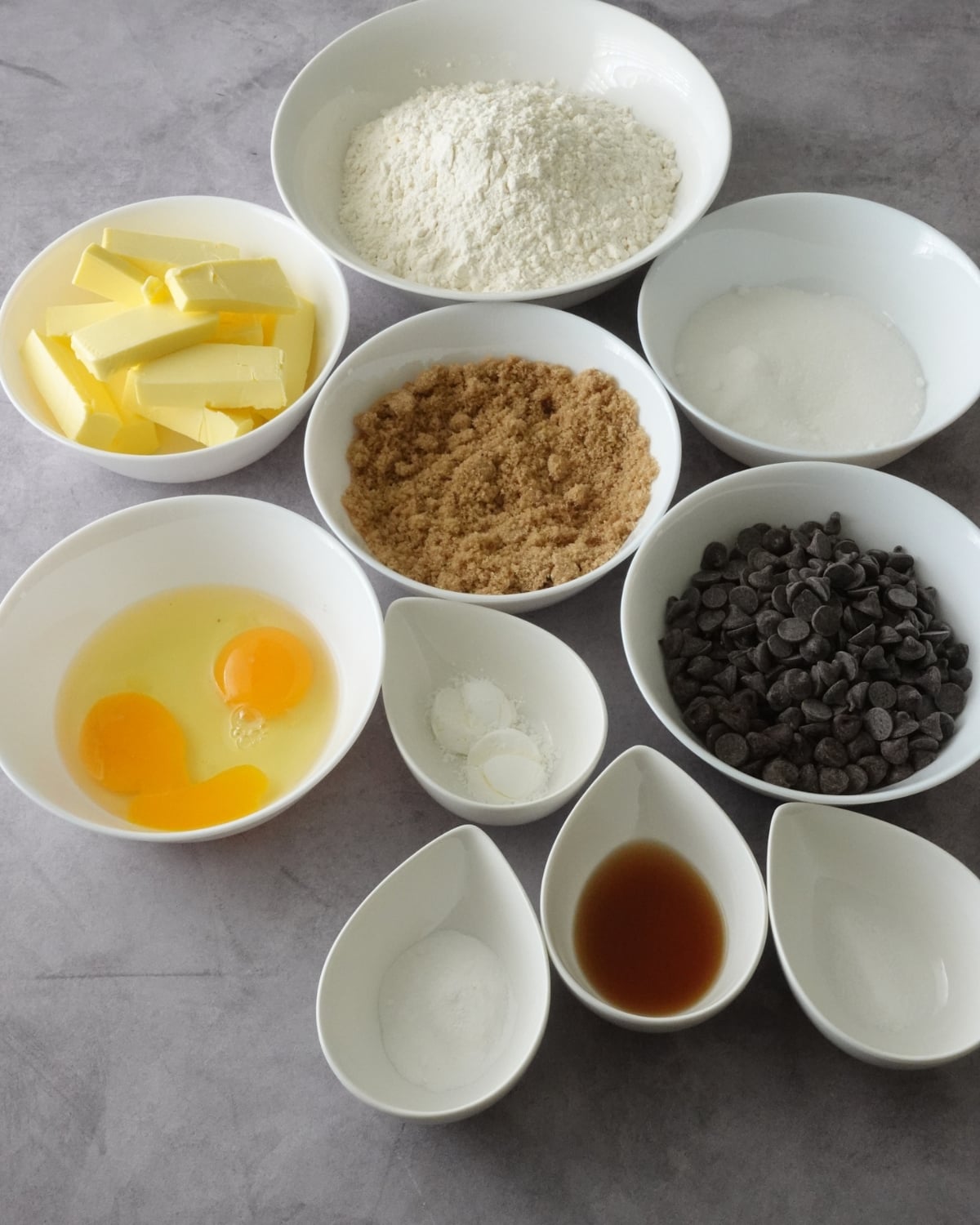 Ingredients for Nutella Deep Dish Cookies including butter, sugar, eggs, flour, chocolate chips