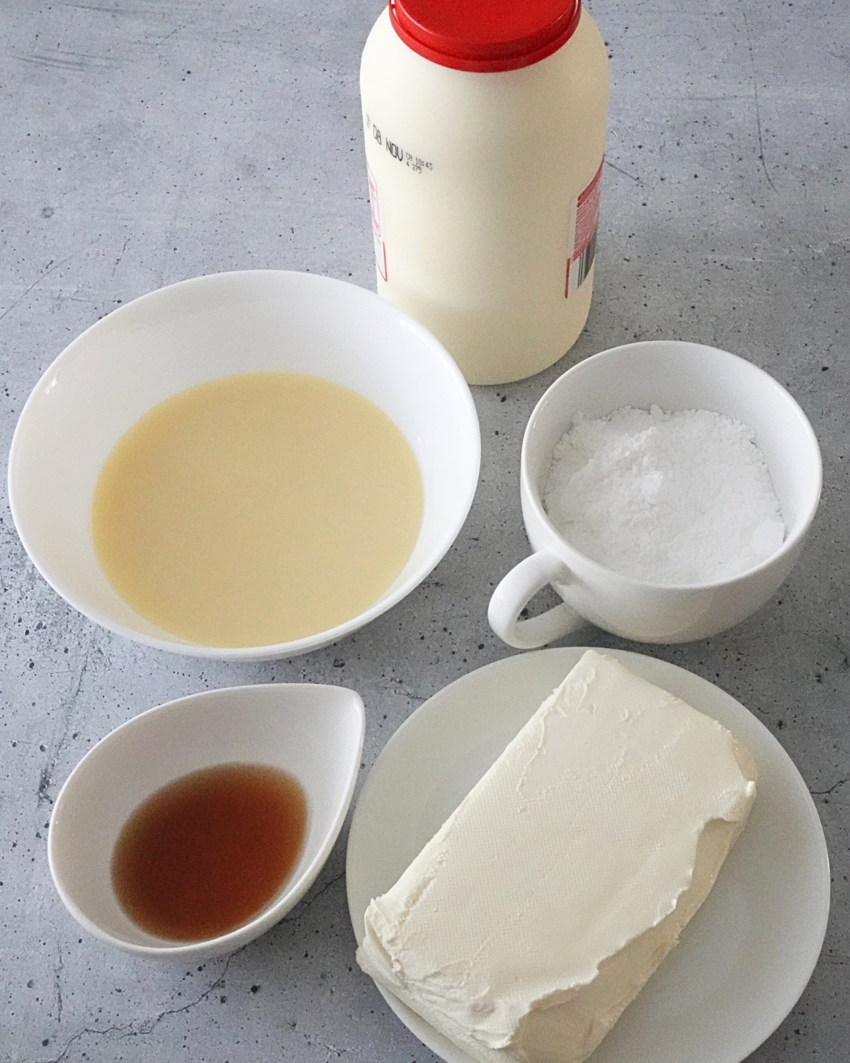 tiramisu cheesecake topping ingredients including cream cheese condensed milk powdered sugar vanilla and thickened cream