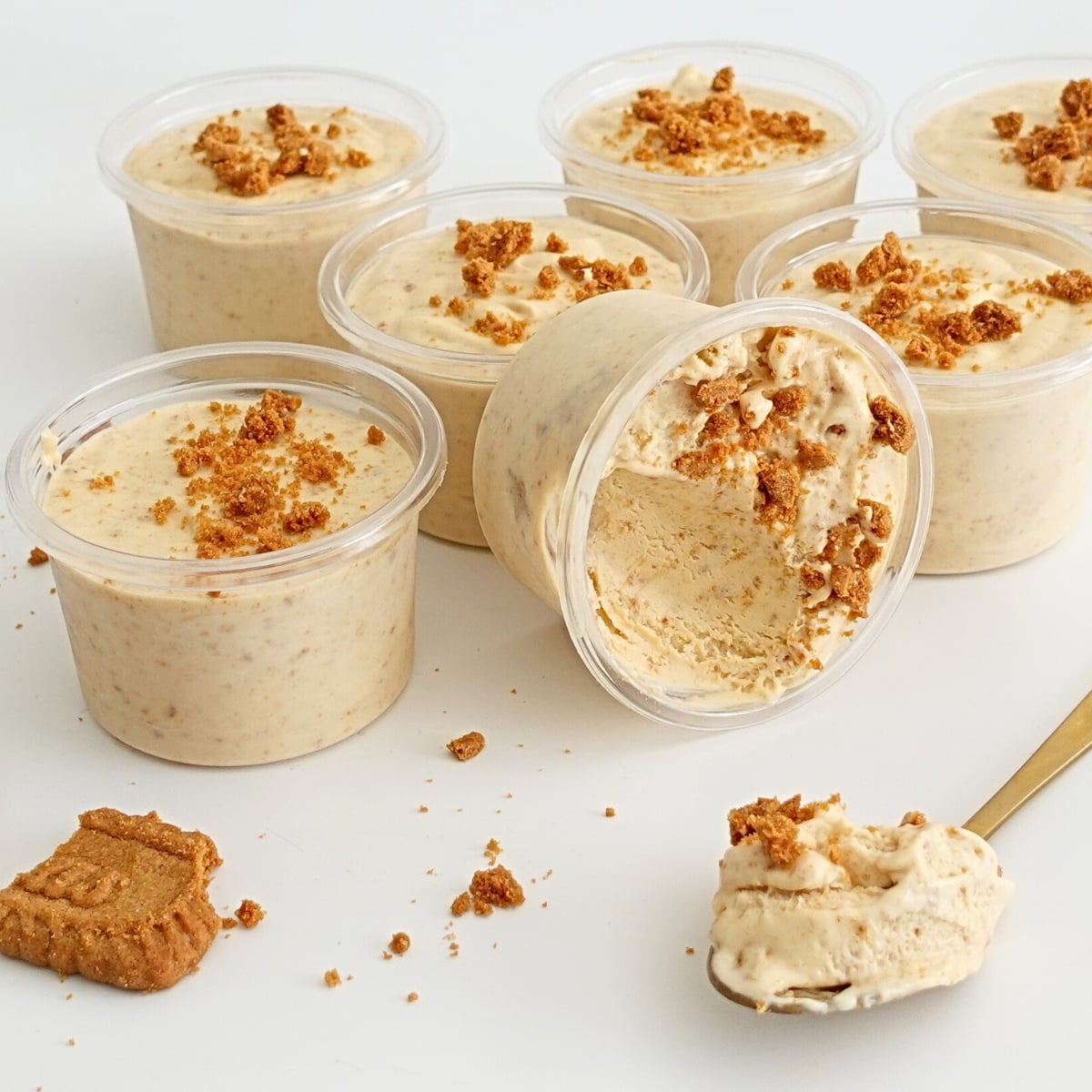 biscoff ice cream cups with cookie crumbs in clear tubs
