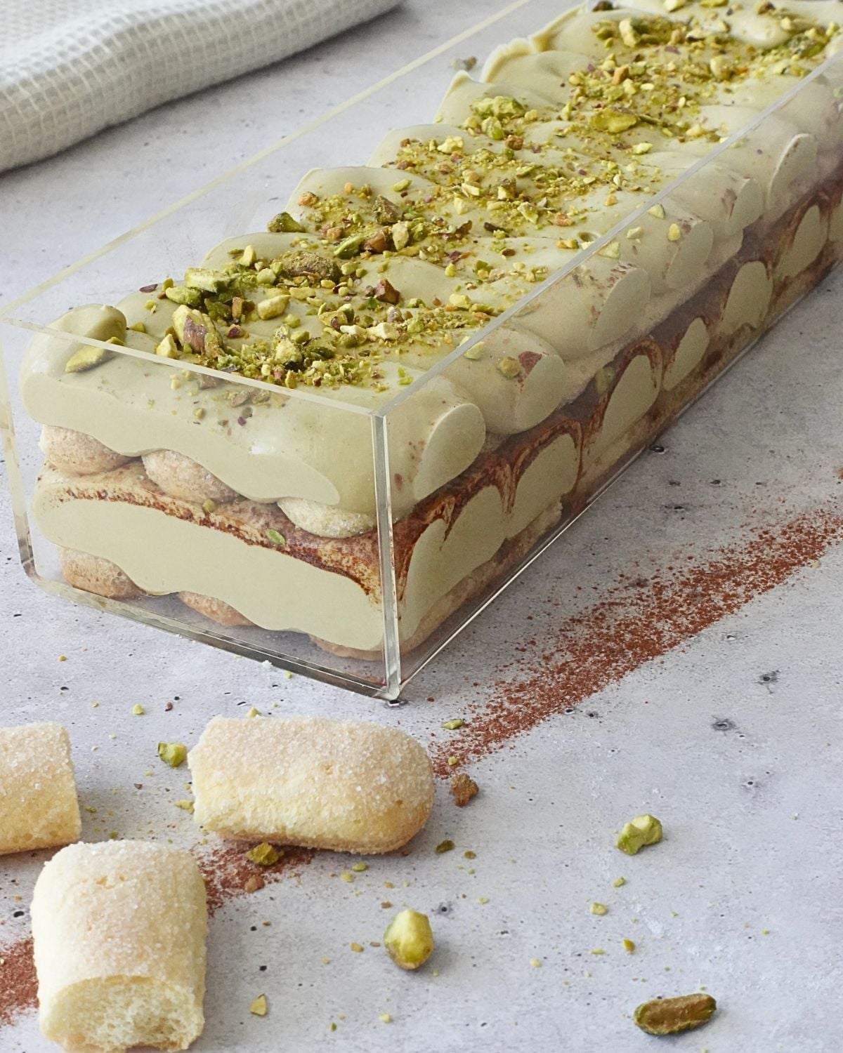 Layered Pistachio Tiramisu Cheesecake Dessert in Clear Dessert Box