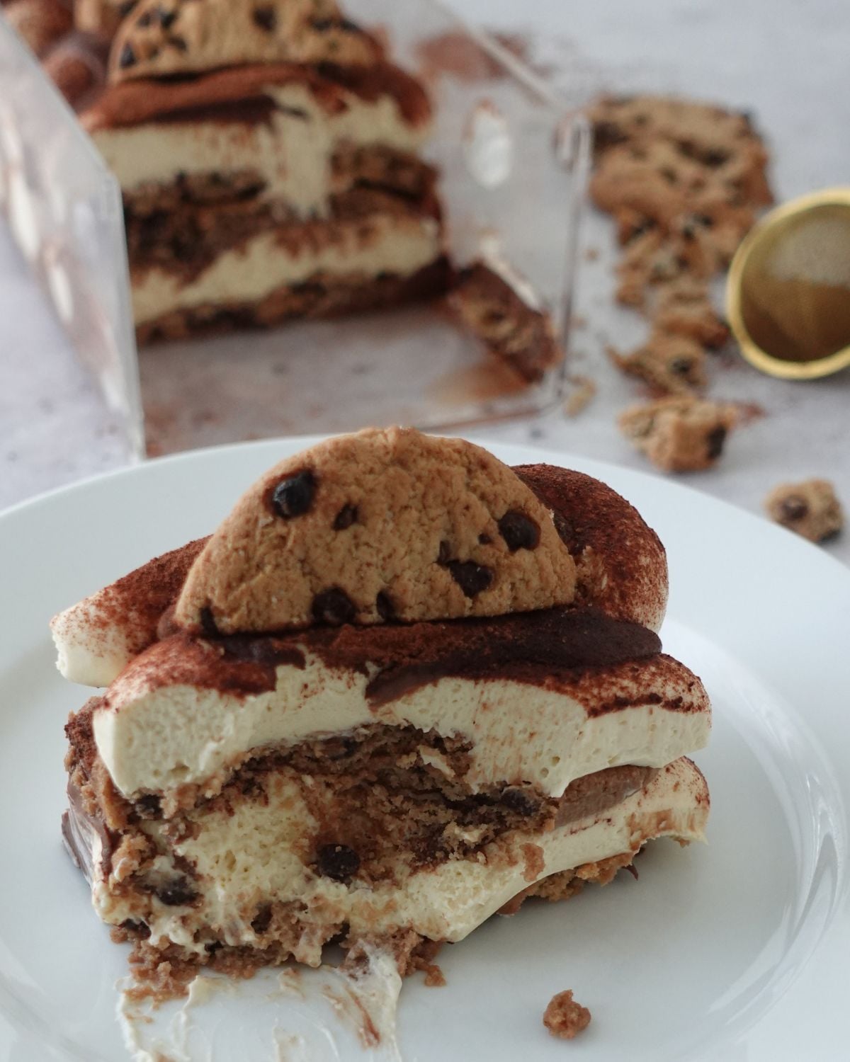 Sliced tiramisu cheesecake showing the layered cookies and coffee cream cheese filling