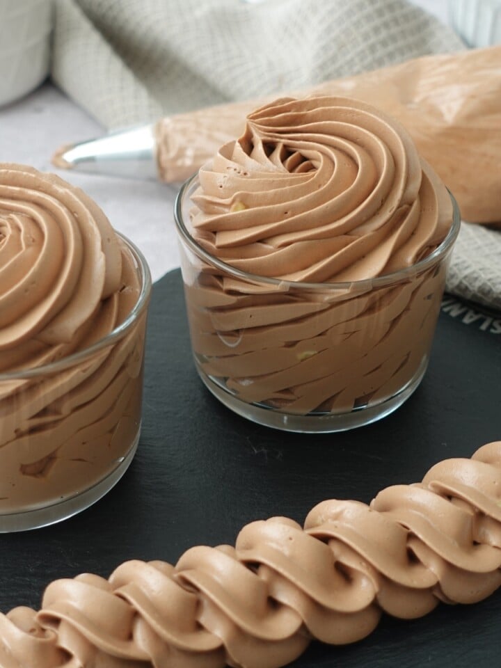 Piped chocolate hot water buttercream swirls and rope border, silky and no grit
