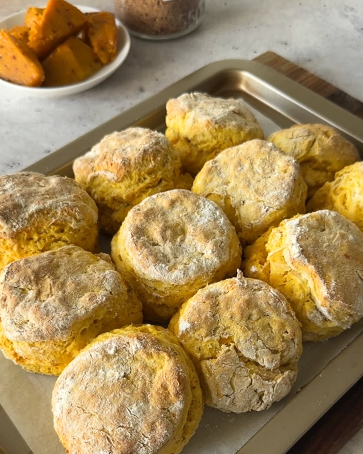 Baked peri peri pumpkin scones golden on a baking tray