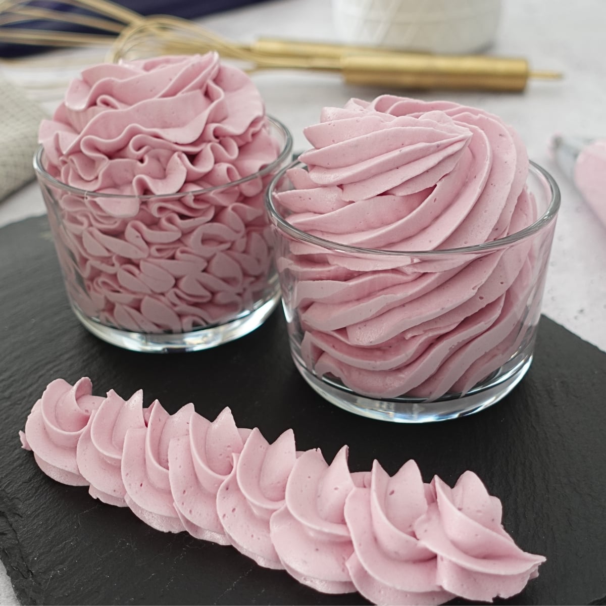 Piped ube hot water buttercream swirls and rope border, smooth and no grit texture